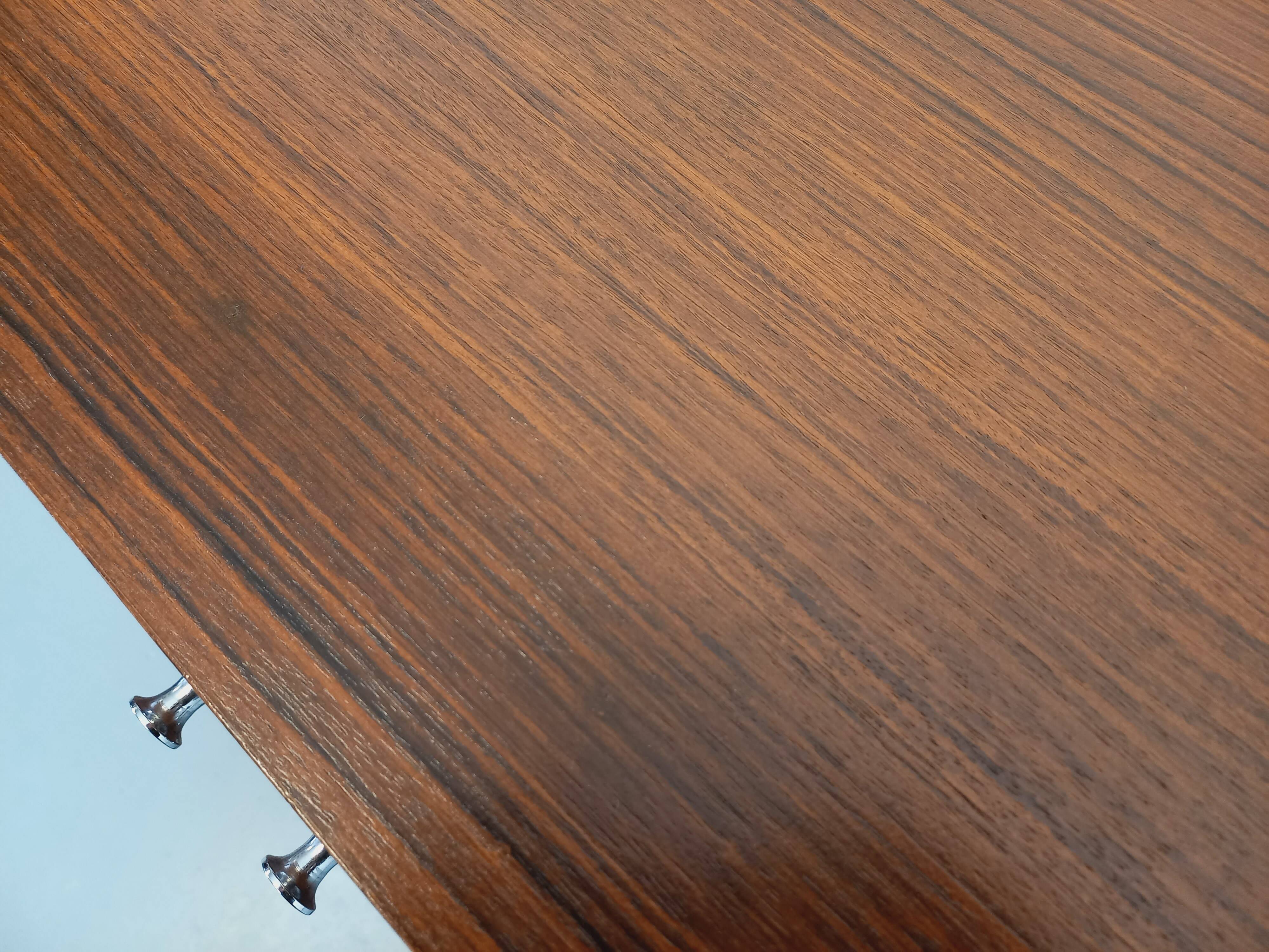 Vintage modernist enfilade in rosewood and chrome metal from the 60s and 70s.