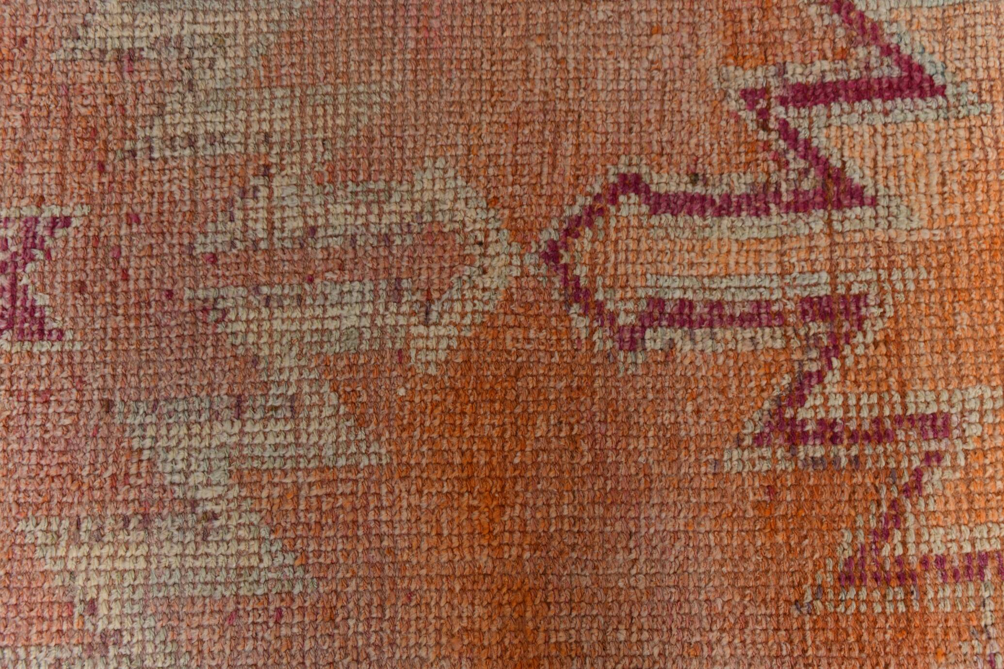 2x12 shades of pale orange vintage runner rug