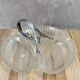 Vintage glass serving tray with silver-plated handle.