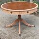 Round extendable table in Empire style, renovated with Bordeaux leather and raw wood, 168cm.