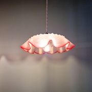Pair of clear and pink satin glass scalloped pendant lights, 1920s-30s
