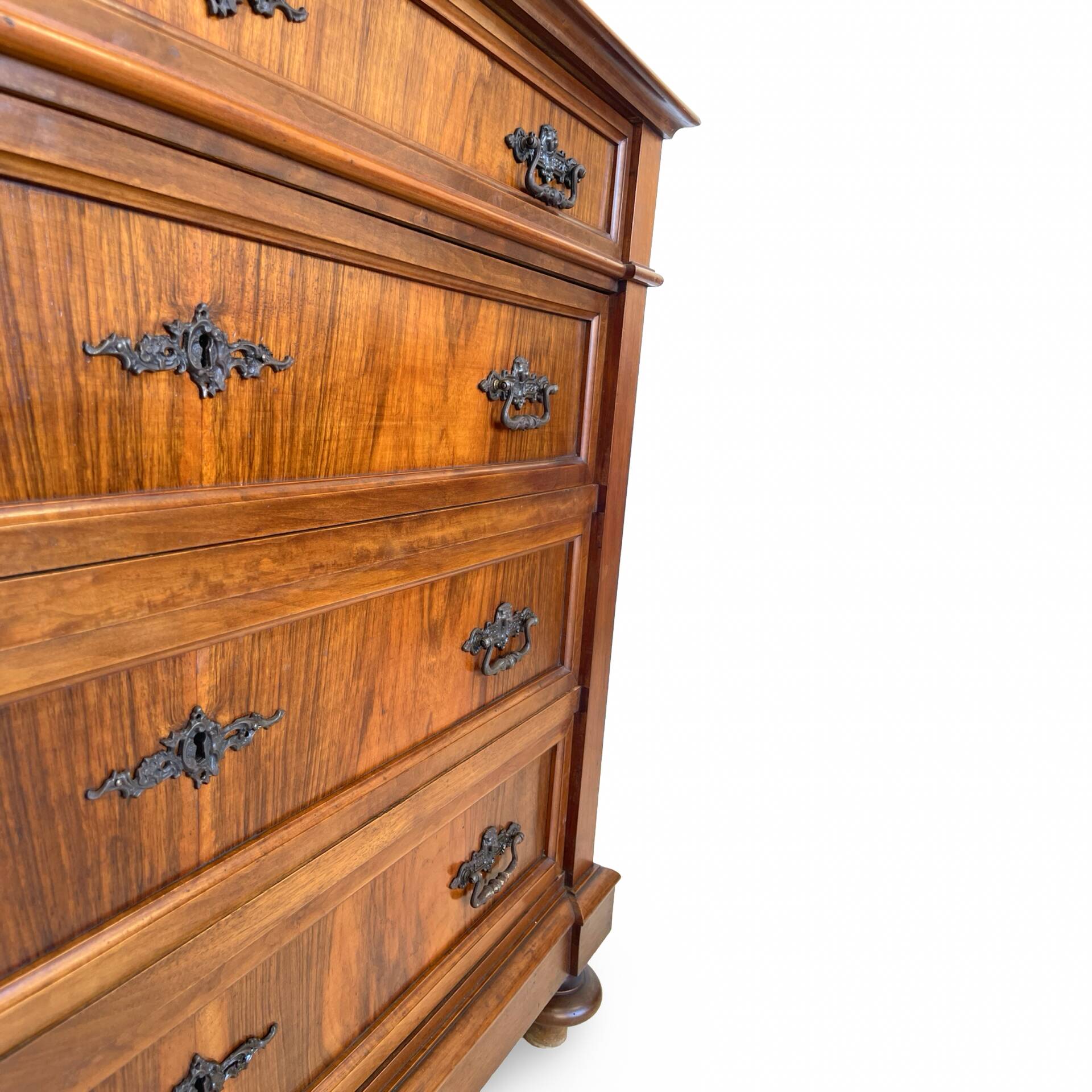Antique walnut commode with bronze handles in the shape of a lion's mask,
