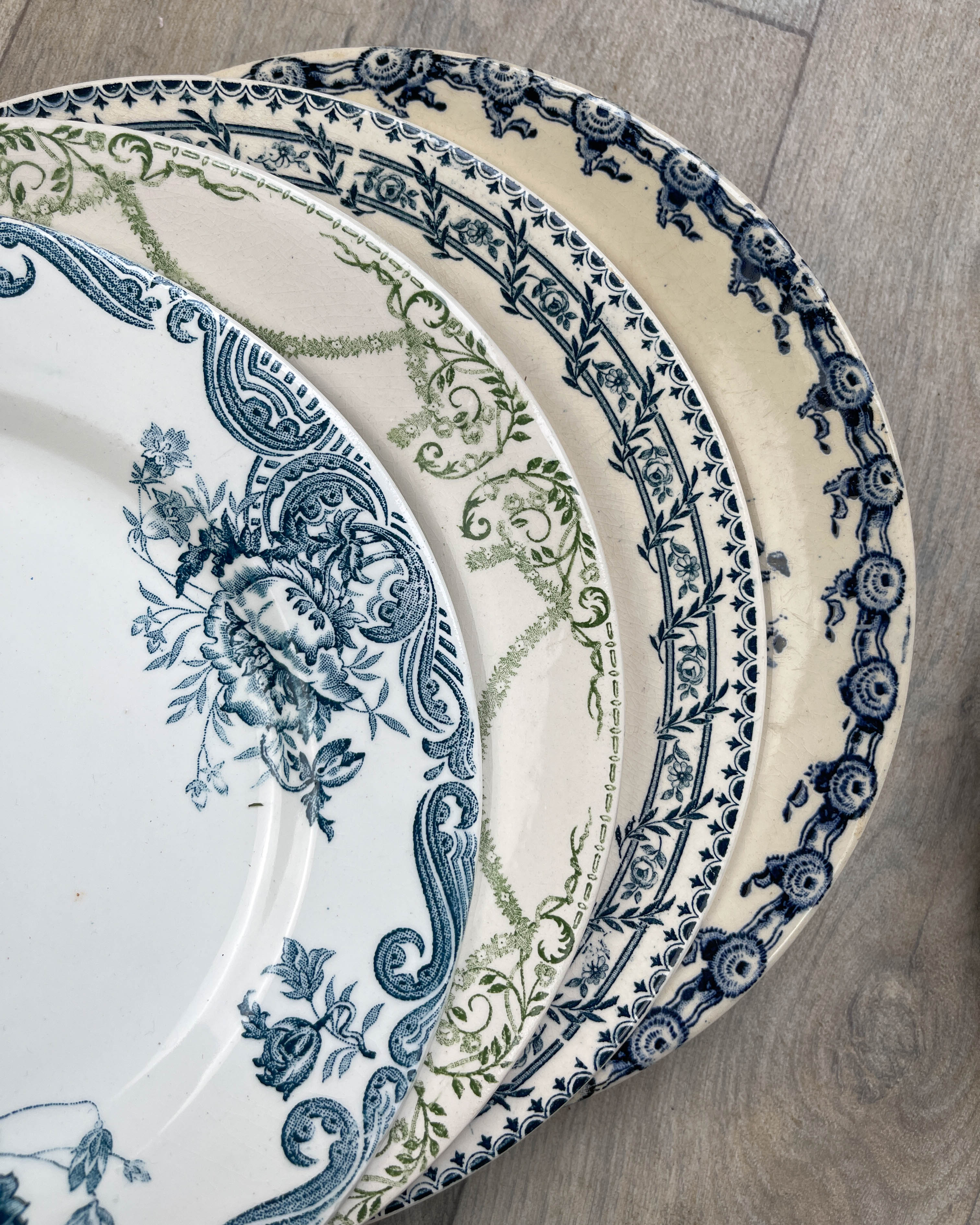 6 green and blue mismatched iron earth plates