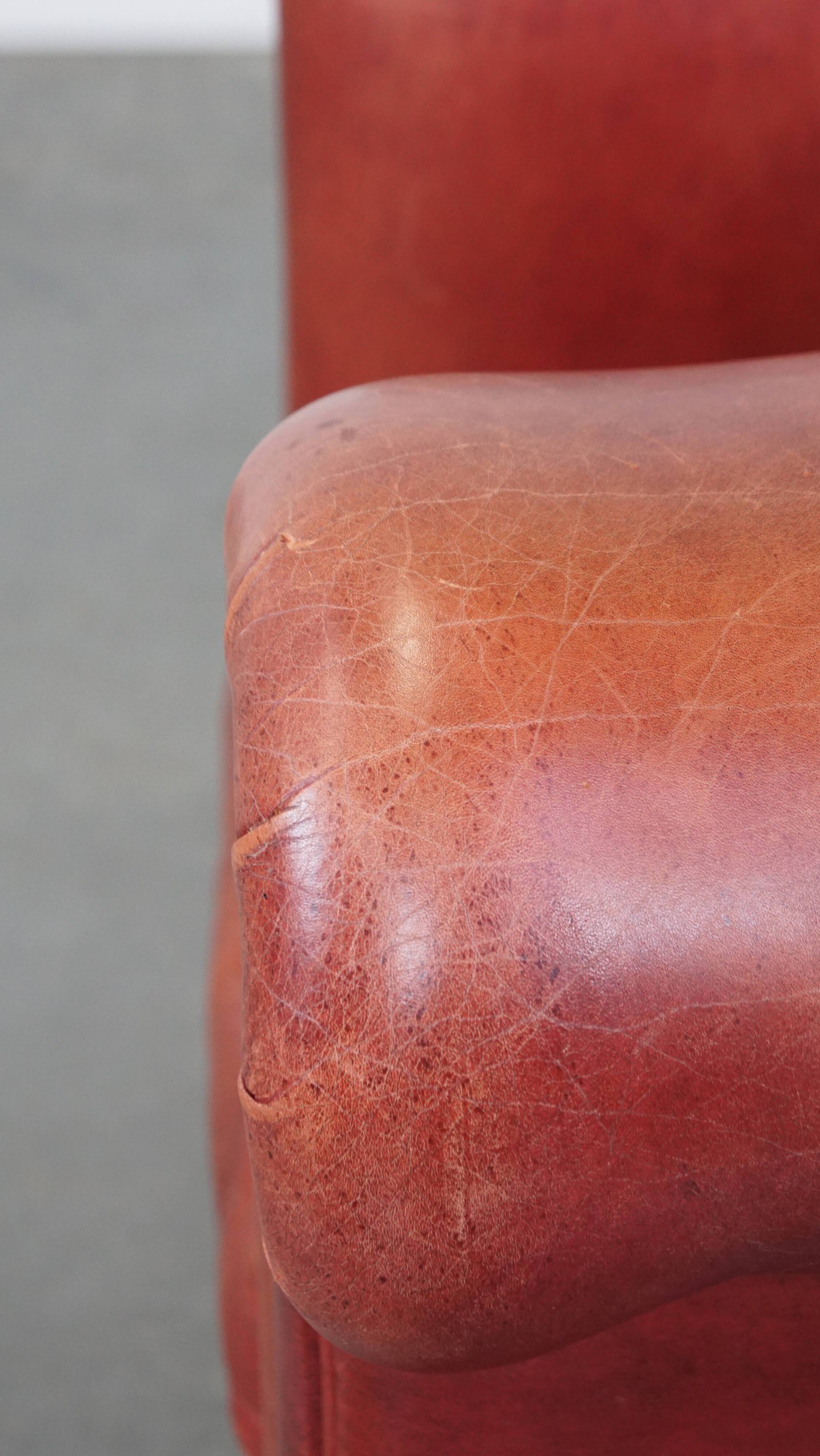 English Chesterfield club chair in light red cowhide leather