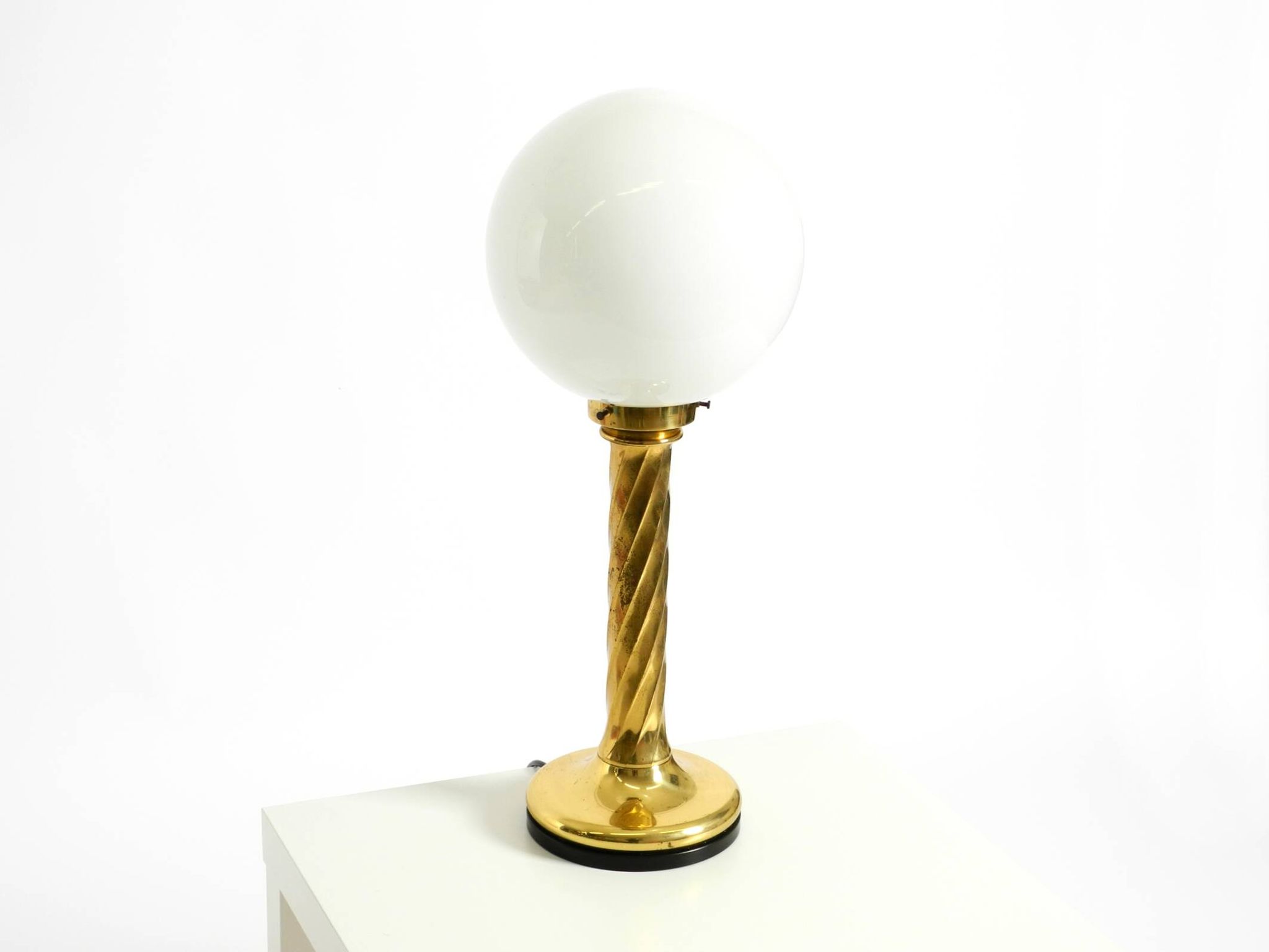 Large 1960s brass column-style table lamp with frosted glass globe