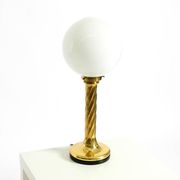 Large 1960s brass column-style table lamp with frosted glass globe