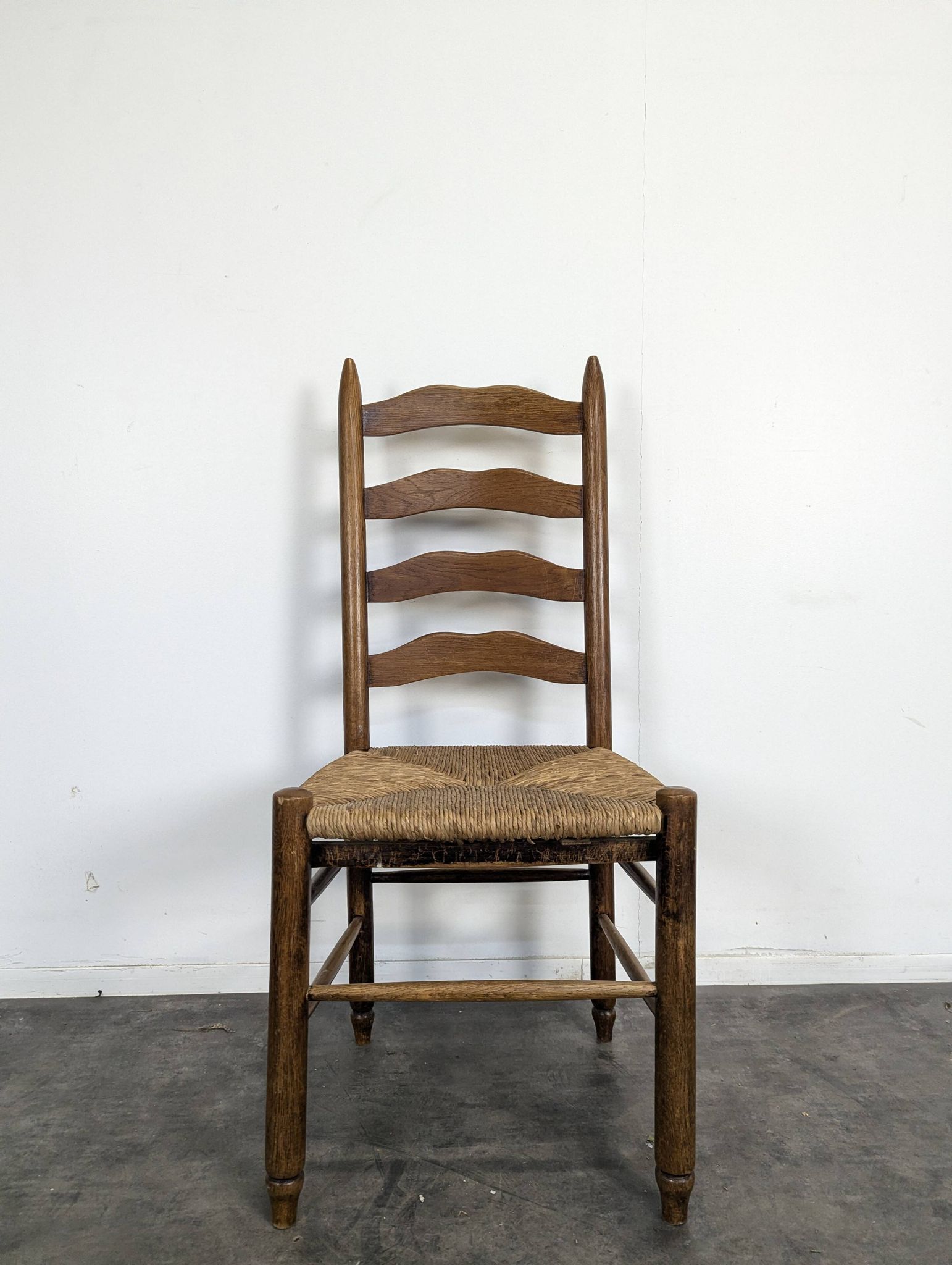 Series of 10 chairs in the style of Charlotte Perriand.