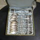 Set of twelve teaspoons and a sugar tongs