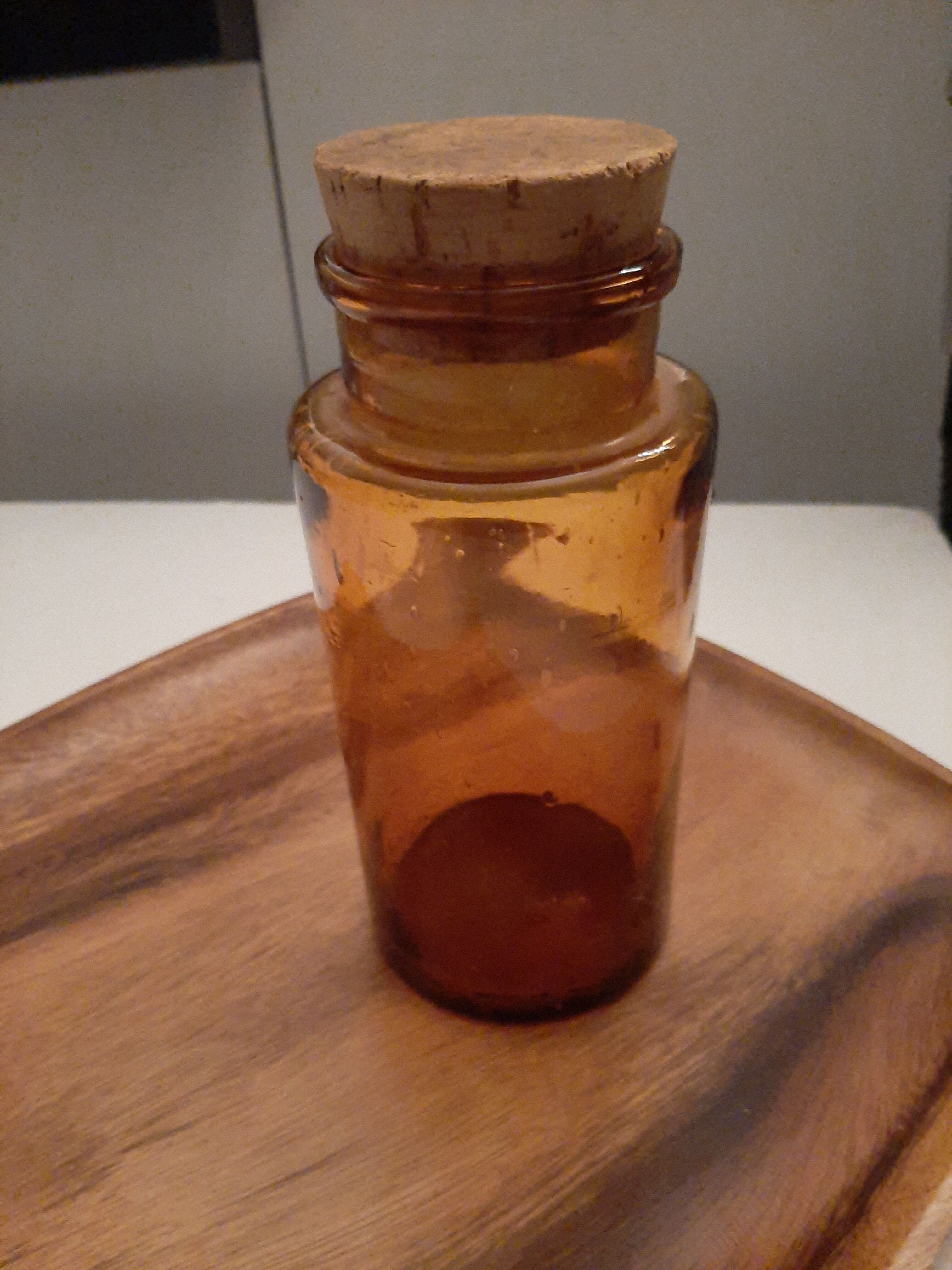 Amber pharmacy bottle made of old bubbled glass