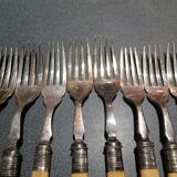 Old silver fish forks with bone handles