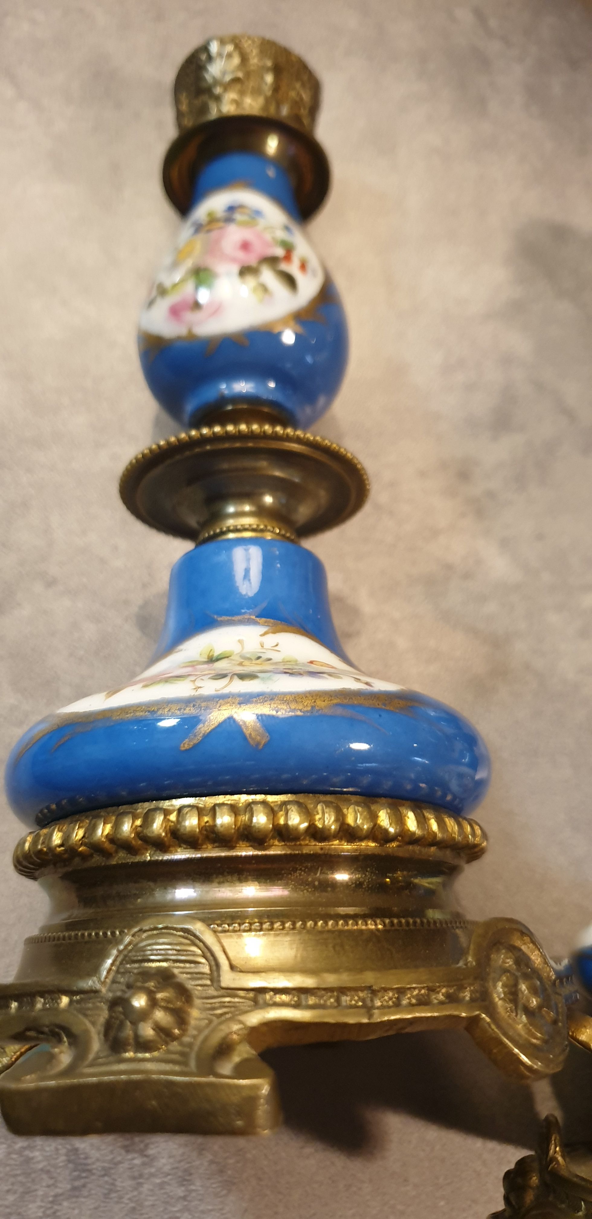 Pair of xixth candle holders, in bronze and enamelled porcelain