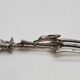 Set of serving forks and silver-plated leg of lamb fork.