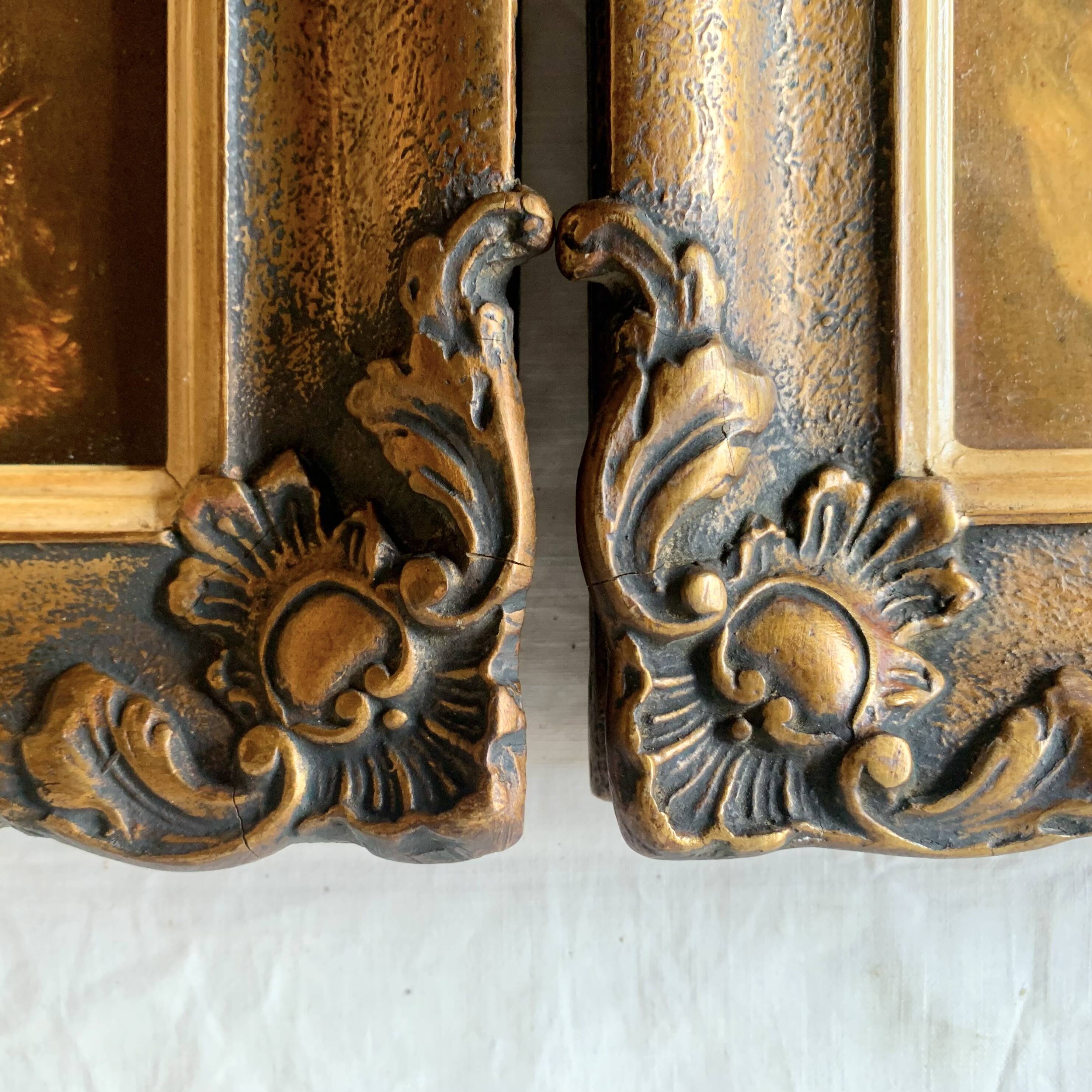 Pair of old carved wooden and plaster frames
