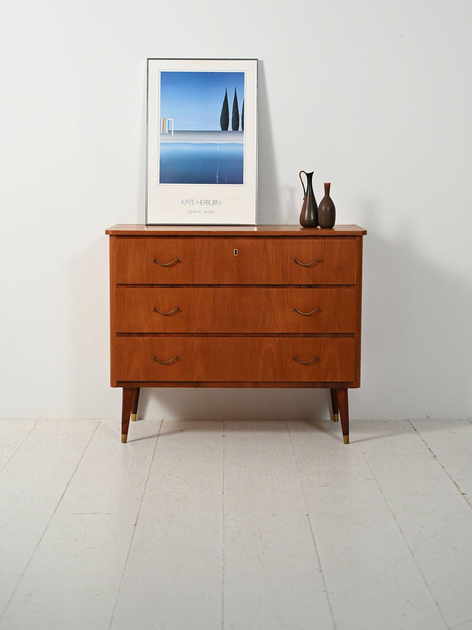 Scandinavian teak and mahogany chest with brass accents