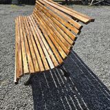 Wooden garden bench with cast iron base