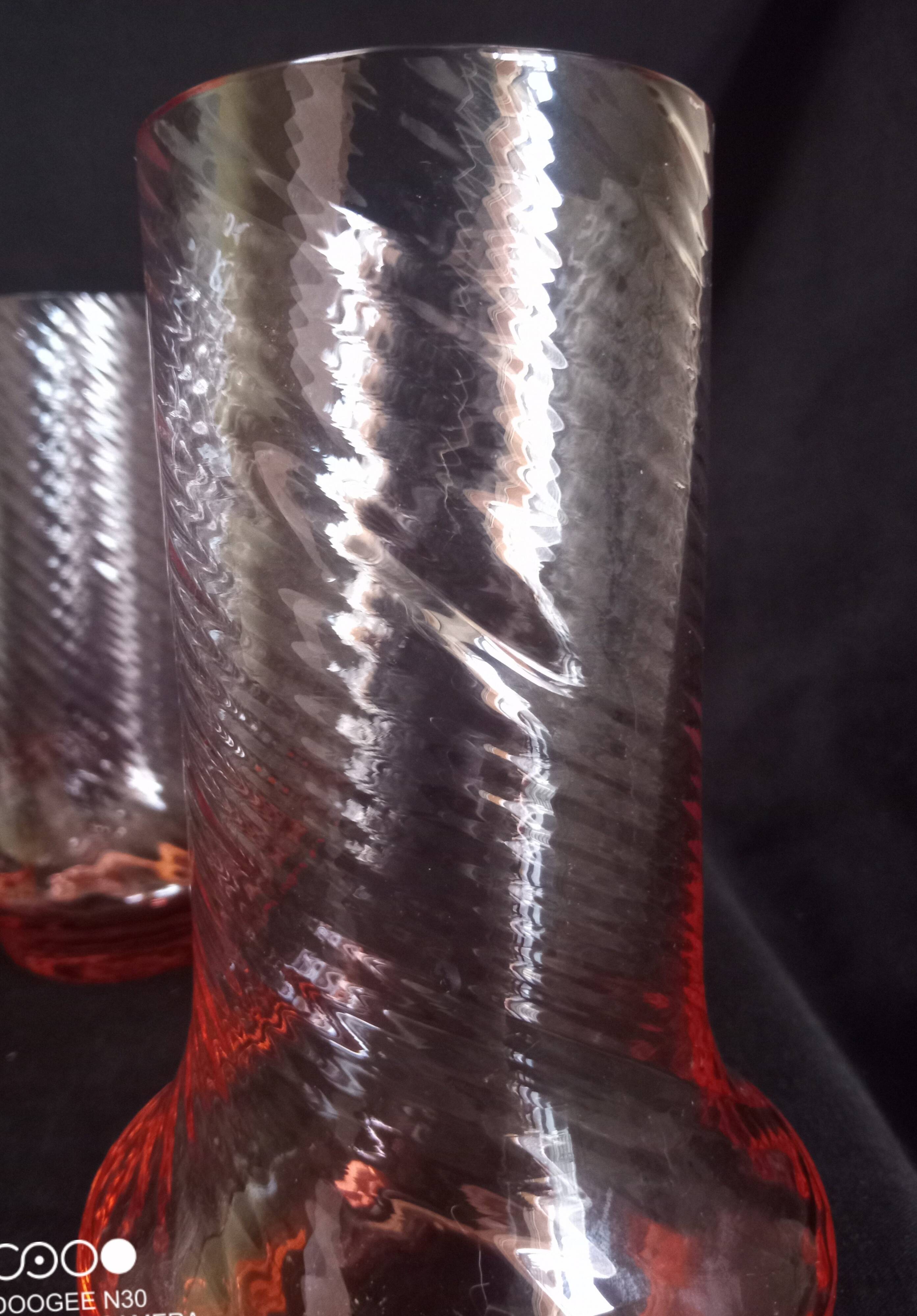 Art Deco orangeade service in pink-orange glass, twisted model.