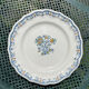 Composition of 4 flat earthenware plates, Gien