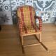 Antique miniature rocking chair in rattan for dolls.