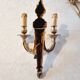 Pair of Louis XV style rocaille two-armed sconces in gilded bronze