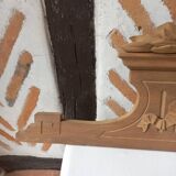 Old sandblasted wooden pediment