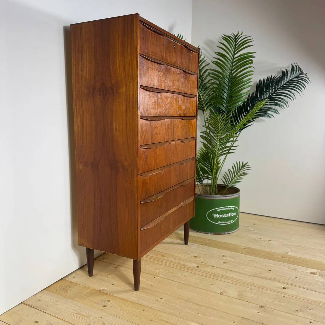 Mid-century Danish high chest of drawers with eight teak drawers.