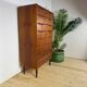 Mid-century Danish high chest of drawers with eight teak drawers.