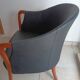 Pair of leather and wood armchairs in the style of Umberto Asnago.