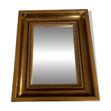 Bronze-colored framed mirror