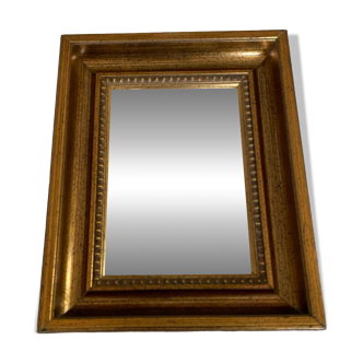 Bronze-colored framed mirror