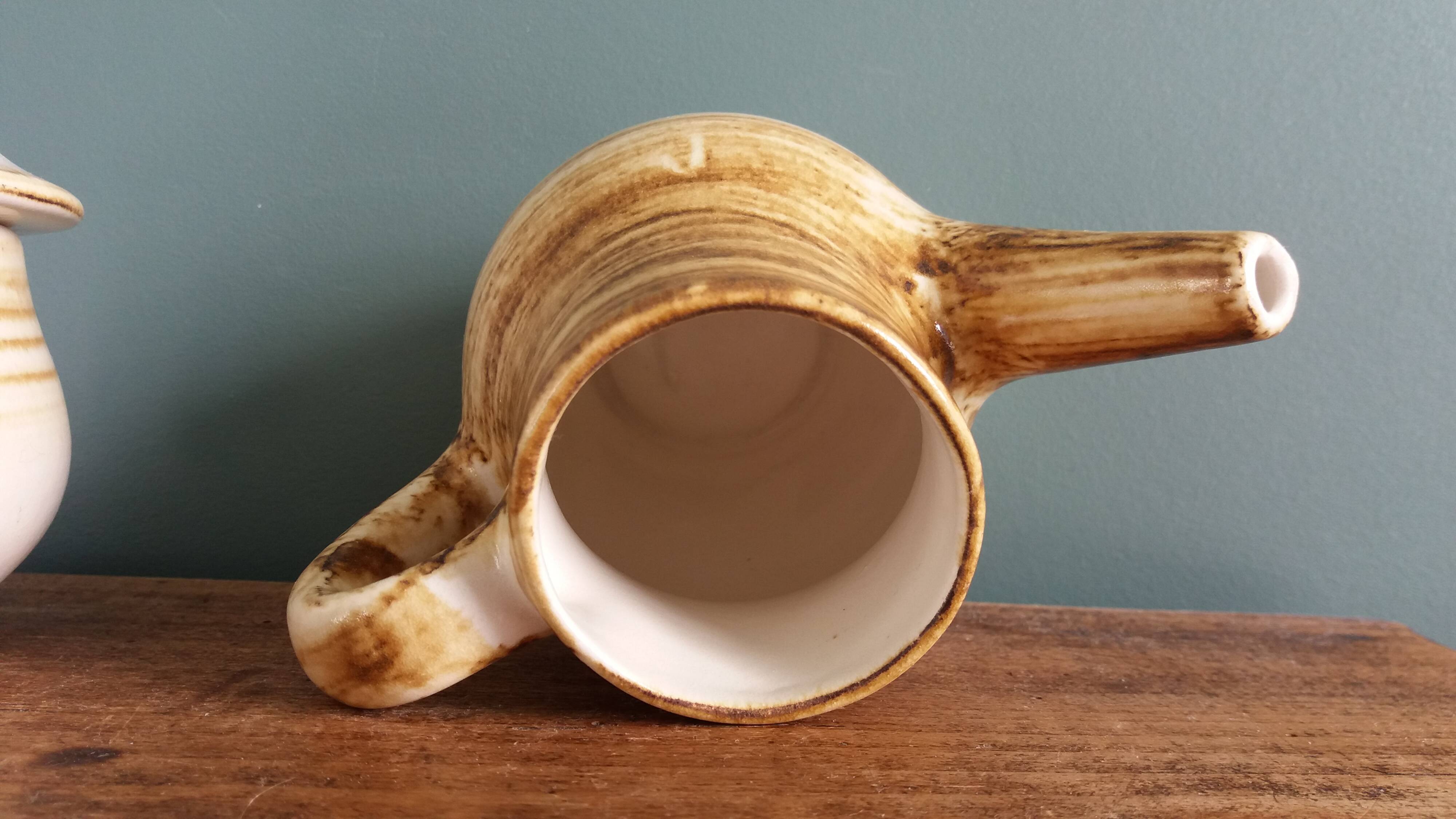 Sugar bowl and milk jug in Longchamp earthenware.