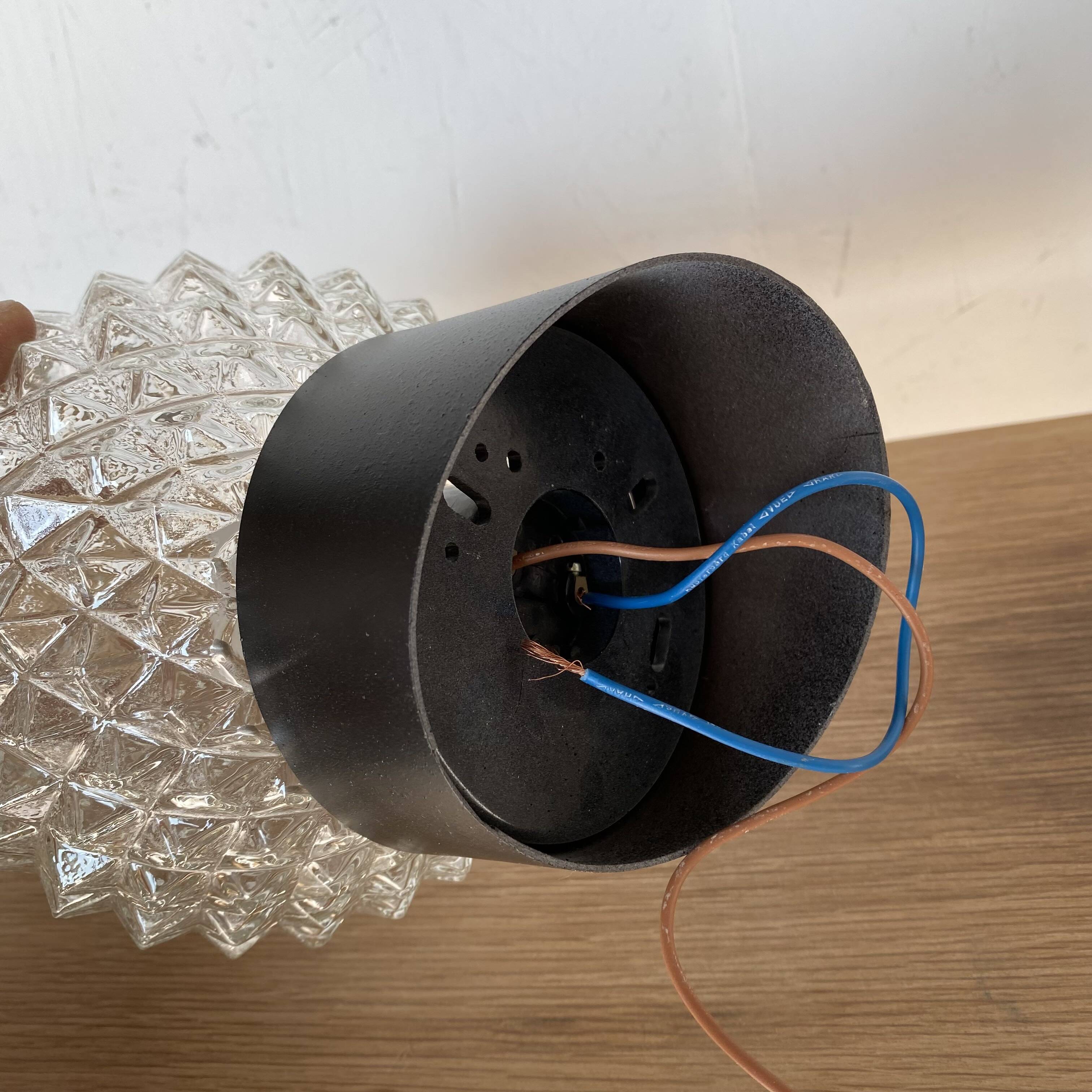 Pair of slanted glass wall lights with black plastic base, decorative v