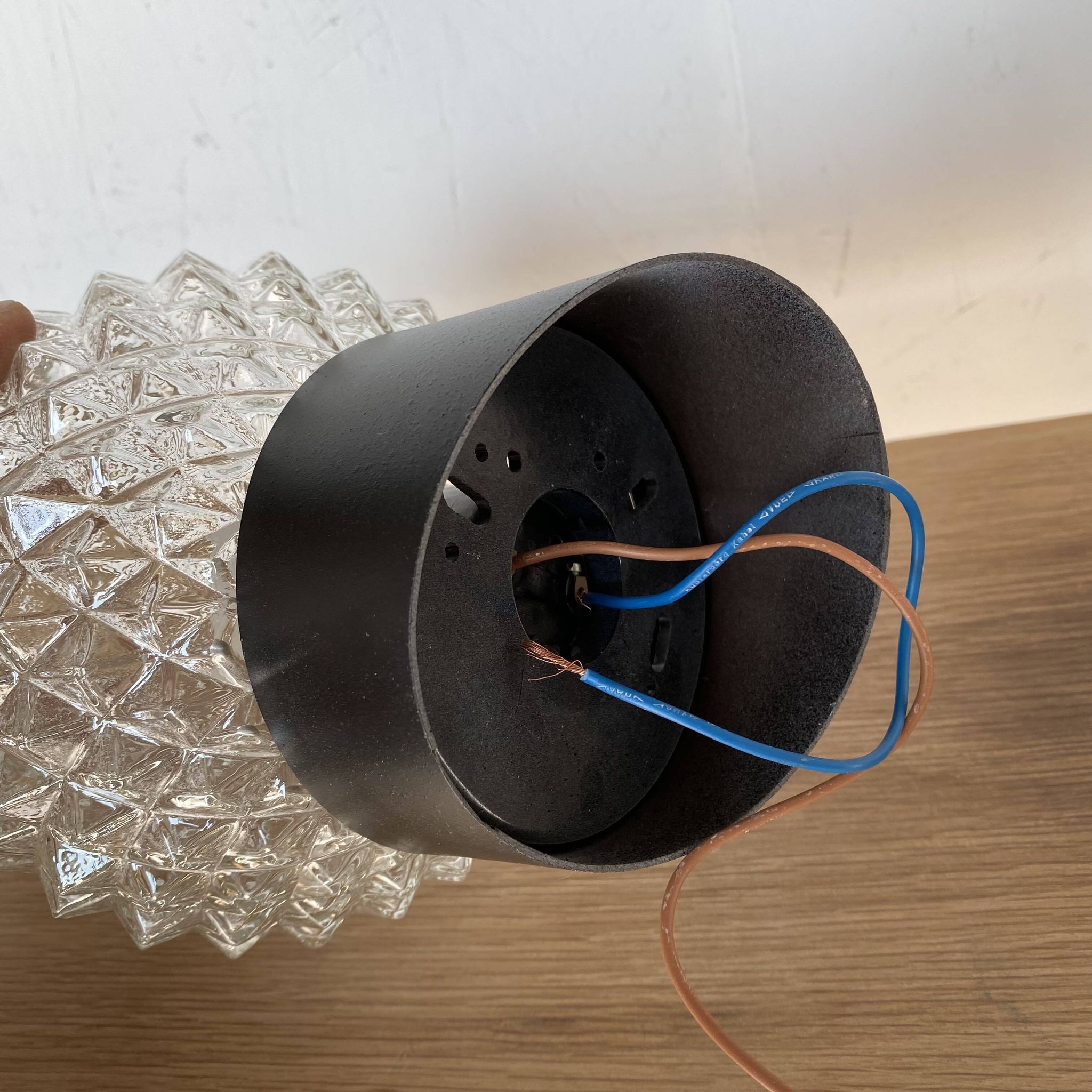 Pair of slanted glass wall lights with black plastic base, decorative v
