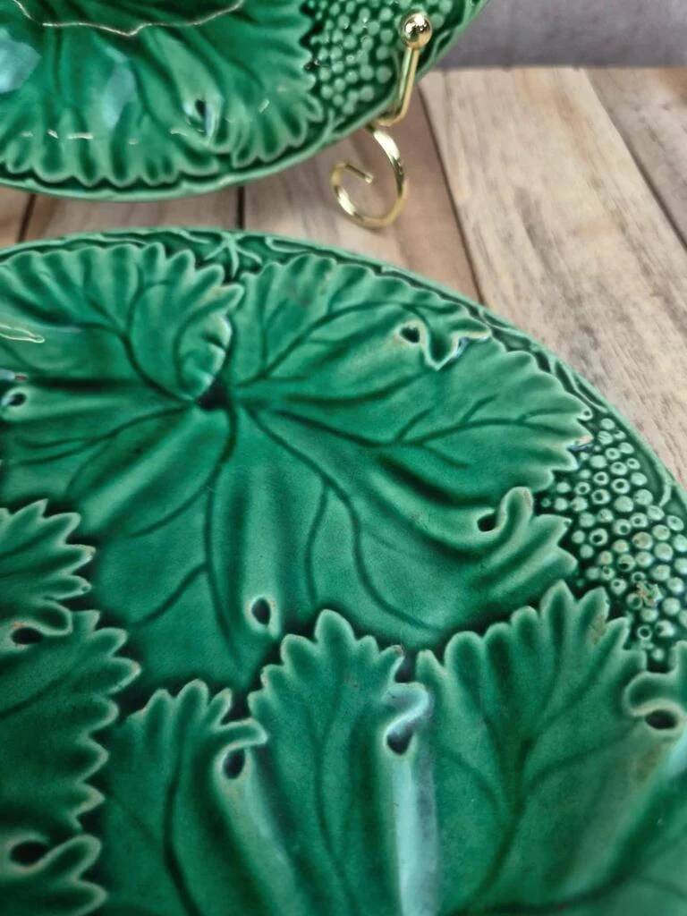 Set of 2 green earthenware dessert plates with vine decoration.