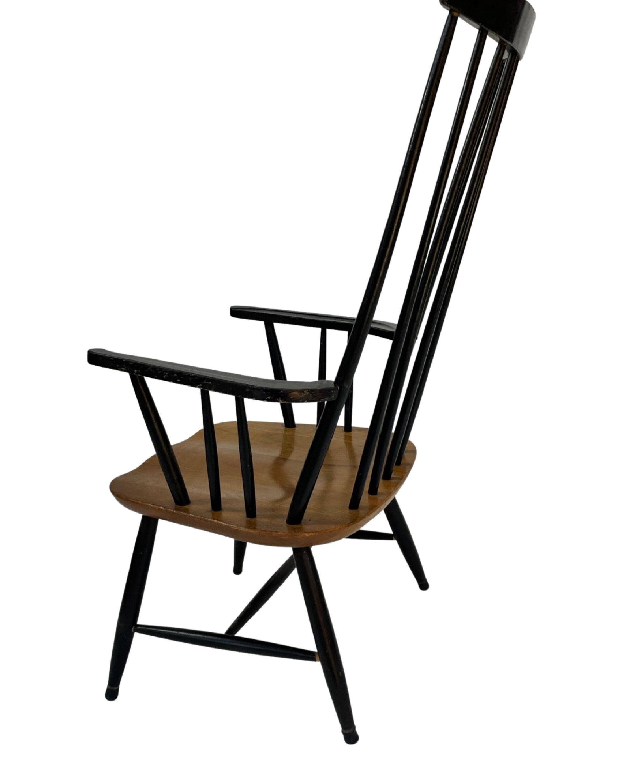 Vintage easy chair with high back and armrest from the 60s