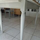 Farmhouse table with pearl gray base and raw wood top.