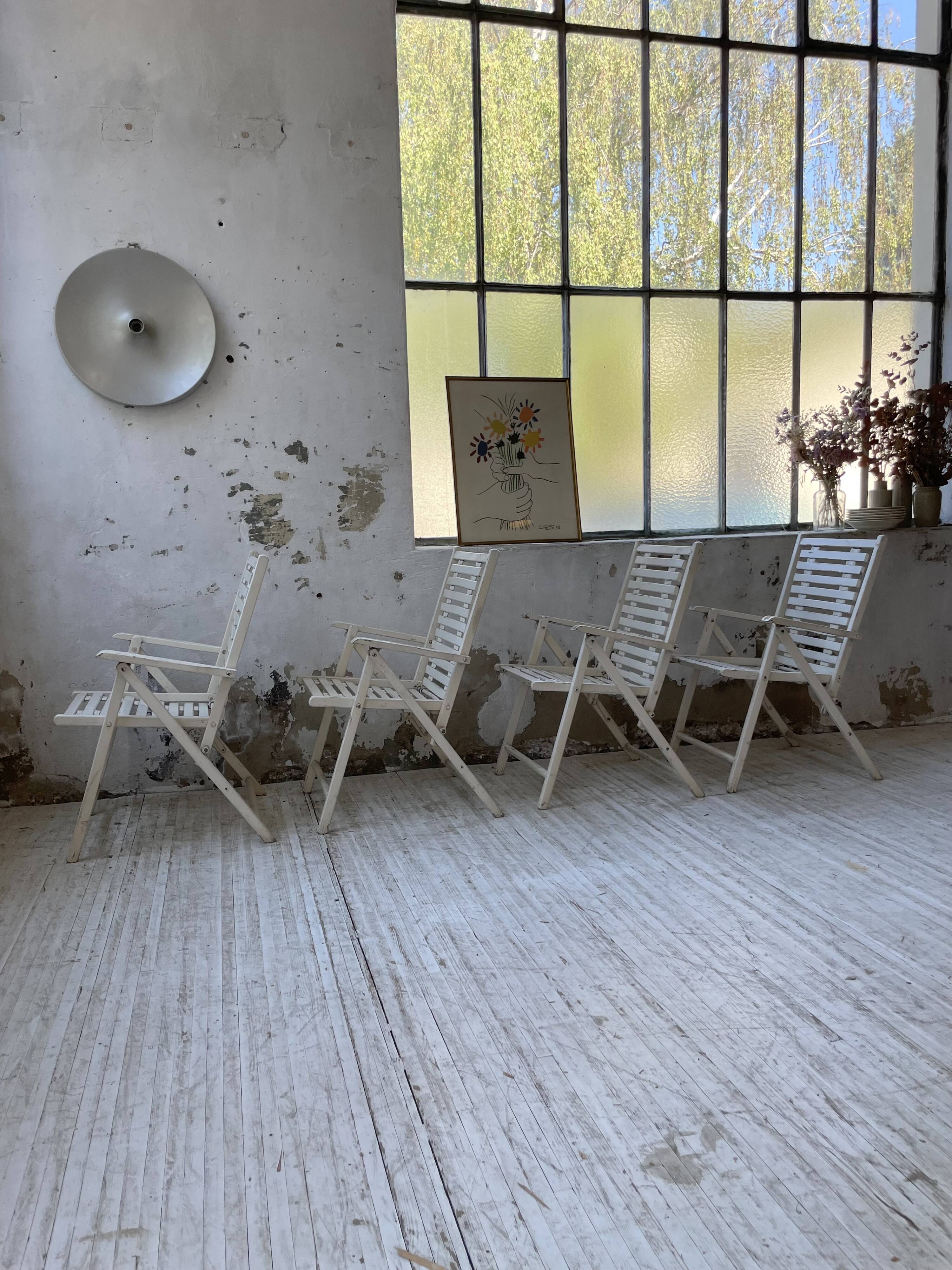 4 white wooden garden chairs