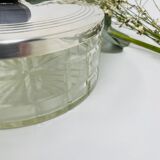 Vintage box made of chiseled glass and covered metal, taken in black Bakelite