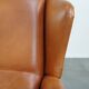 Fauteuil à oreilles en cuir de vache