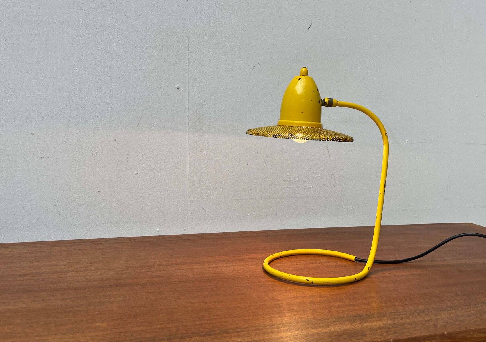 Perforated metal table lamp in Mid-Century Modern style, in the style of Mathieu Matégot, 1960s.