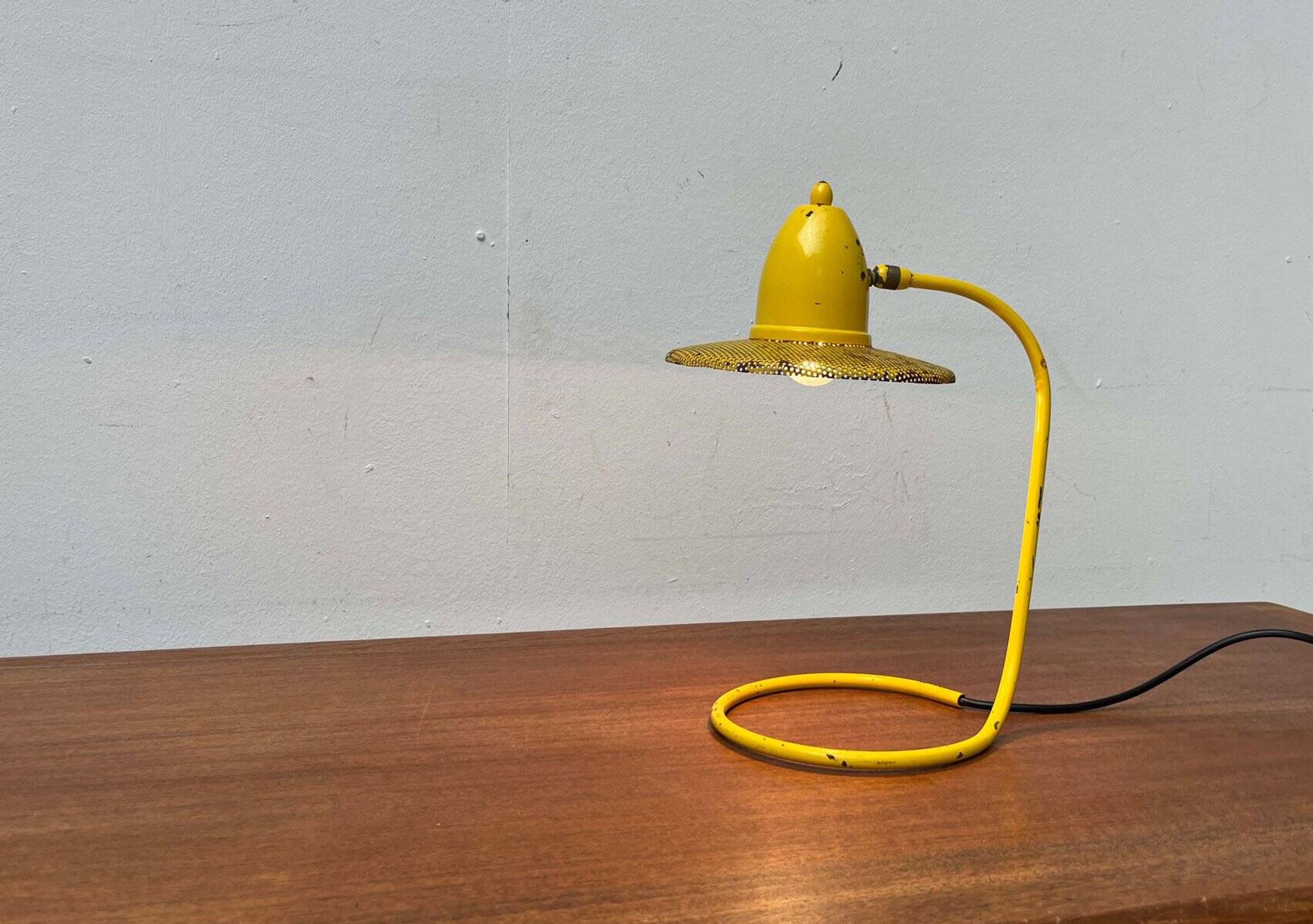Perforated metal table lamp in Mid-Century Modern style, in the style of Mathieu Matégot, 1960s.