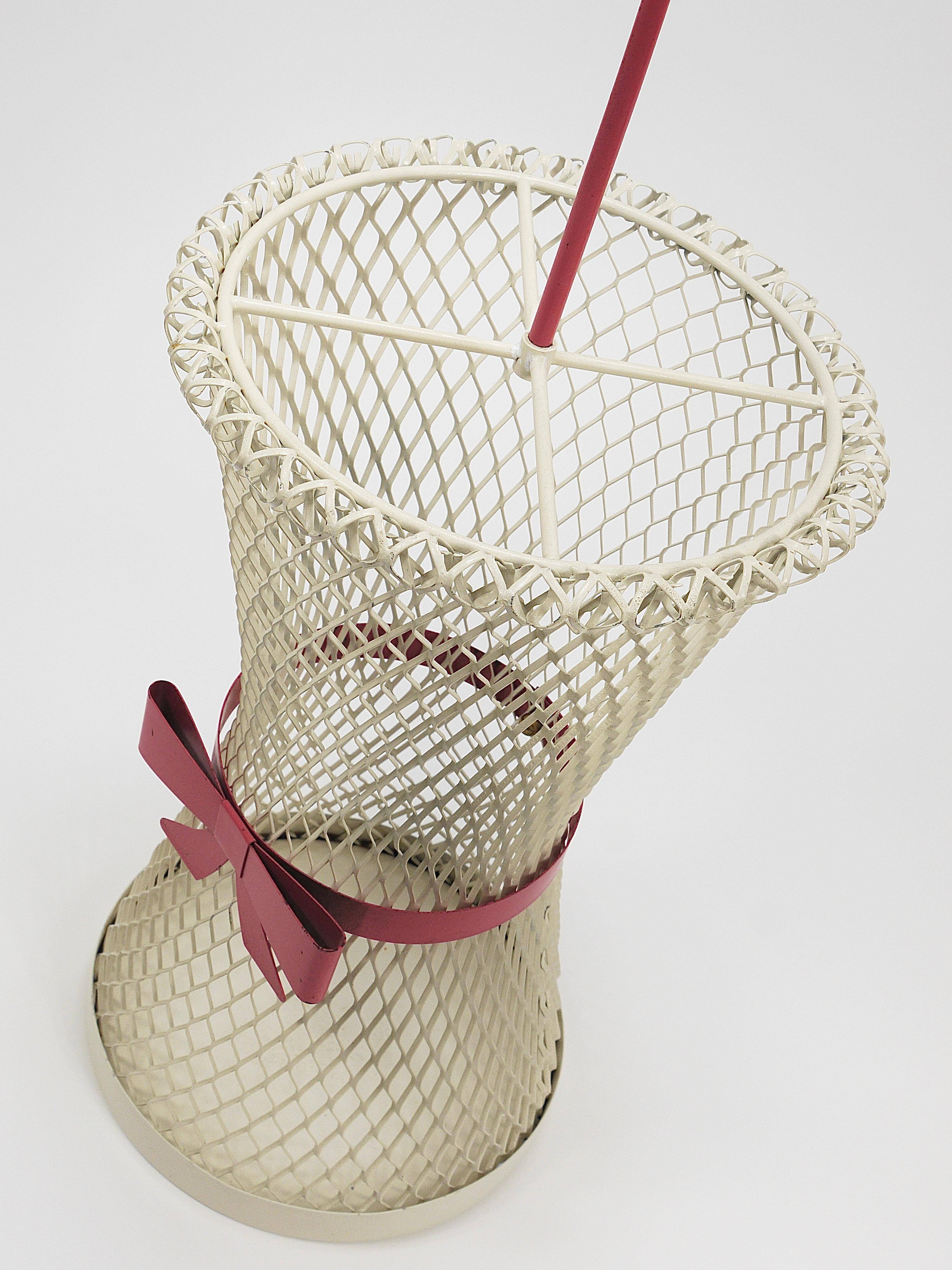 Bow tie umbrella stand in the style of Mathieu Matégot, mid-century, metal, France, 1950s.