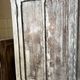 Large Parisian oak wardrobe from the early 20th century with an antique white patina