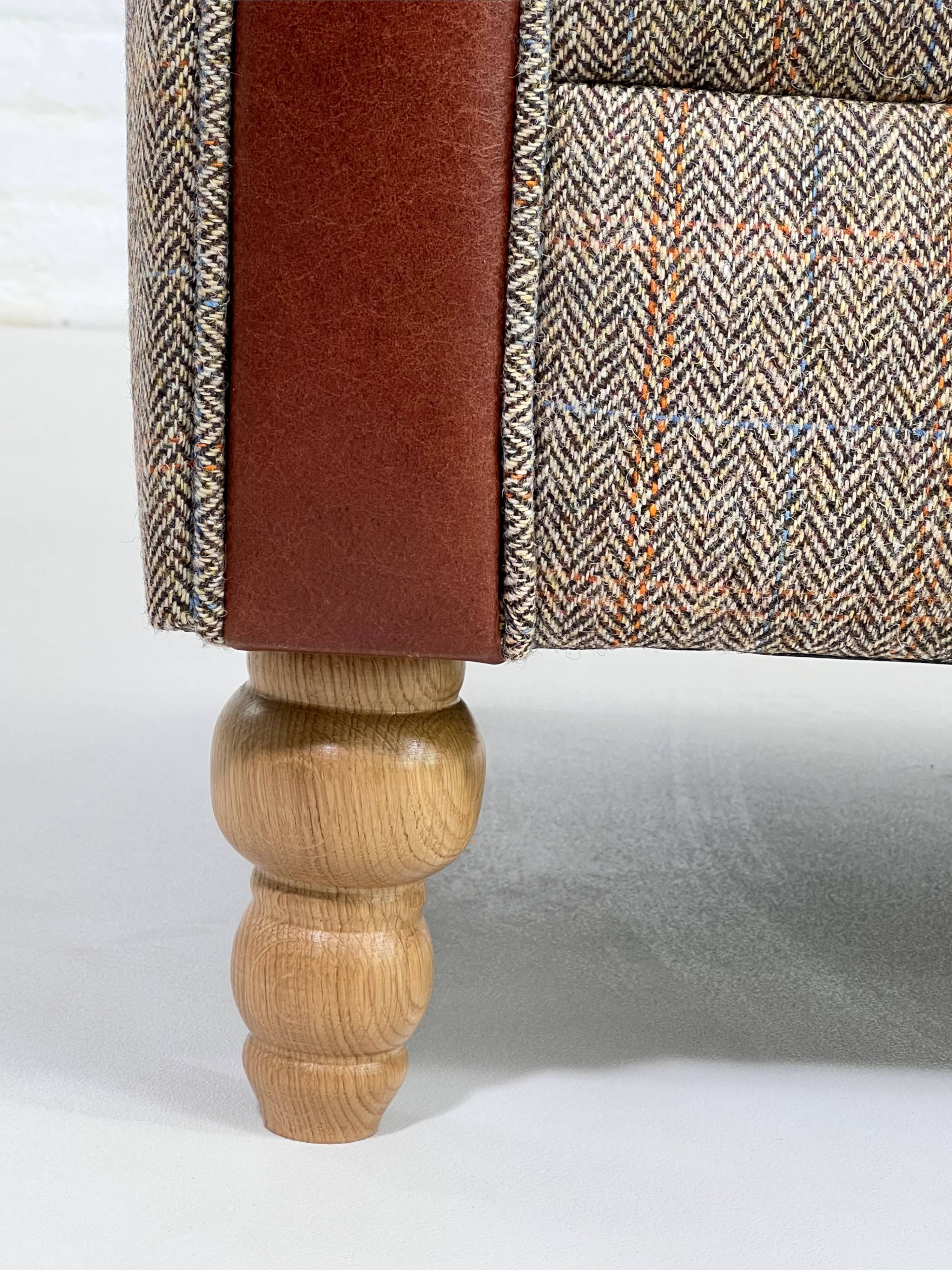Chesterfield sofa in leather, fabric and wood