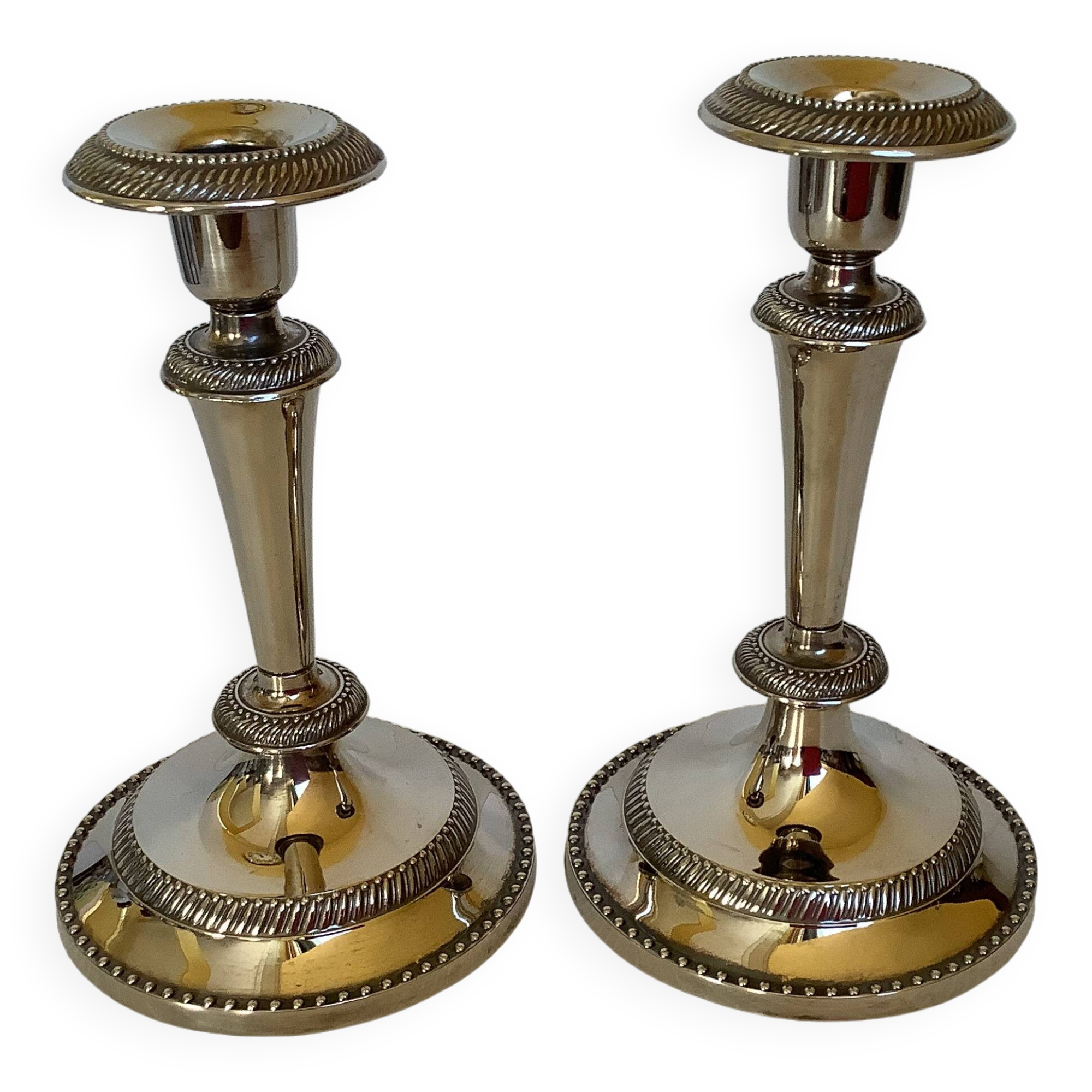 Pair of silver-plated zinc metal candlesticks
