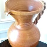 Sandstone jug with twisted handle