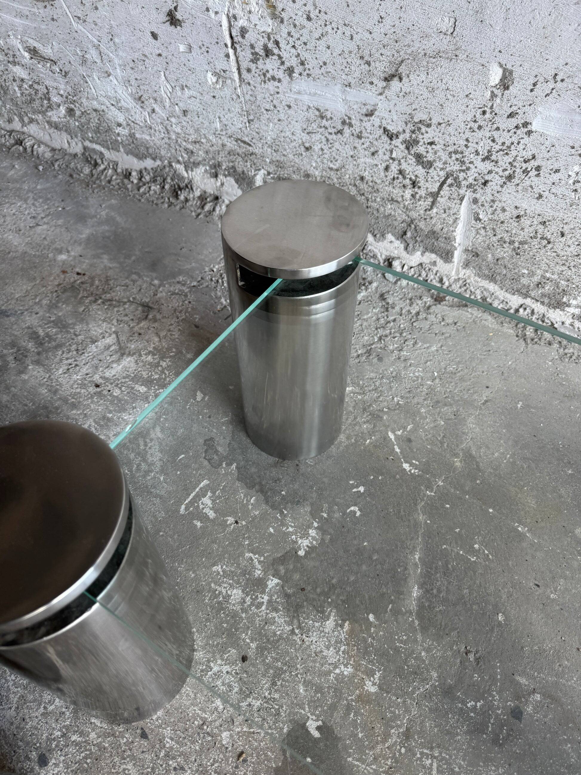 Pair of modernist coffee tables with cylindrical steel legs