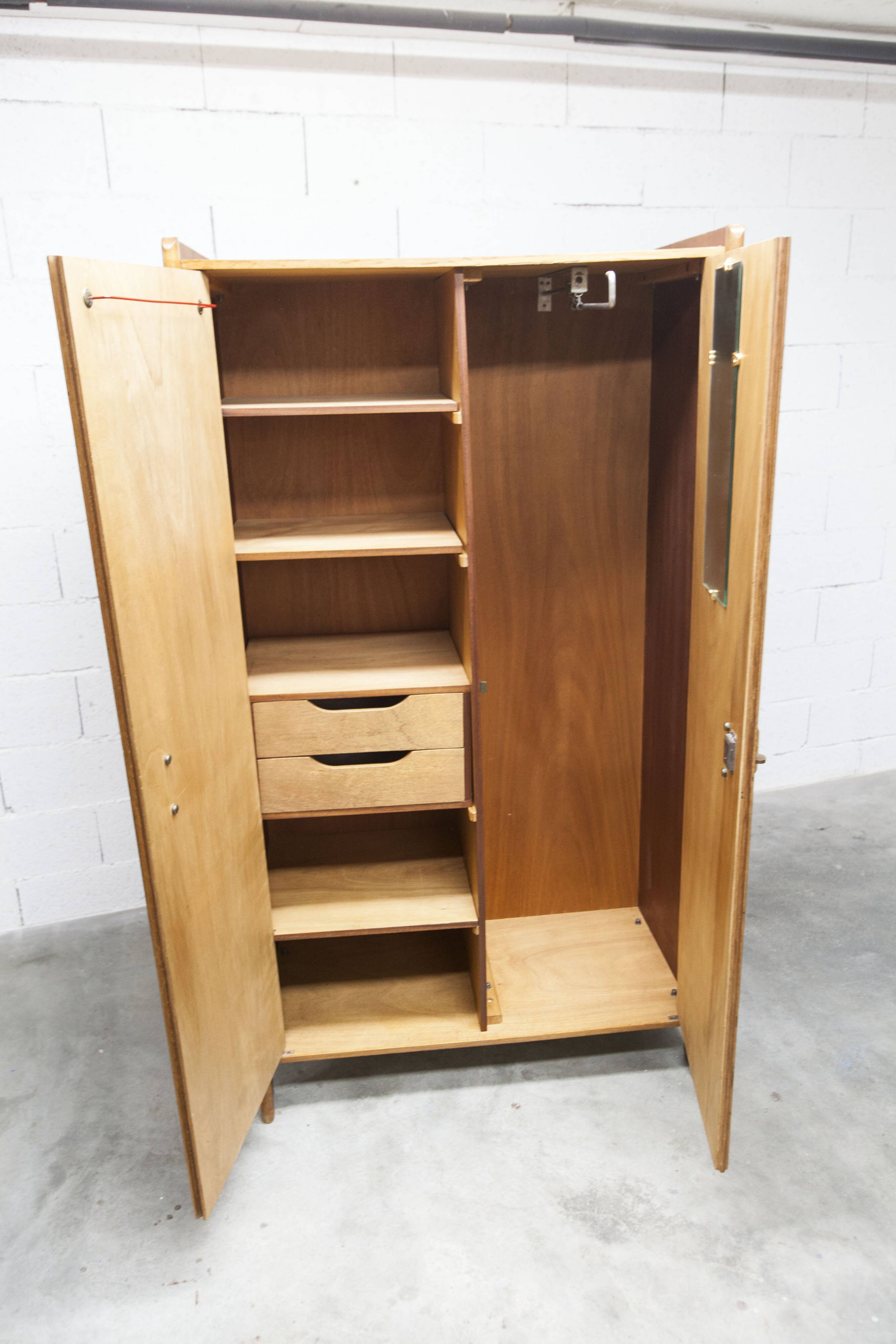 1950s Mid-Century Modern oak armoire with two doors and two drawers.