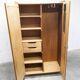 1950s Mid-Century Modern oak armoire with two doors and two drawers.