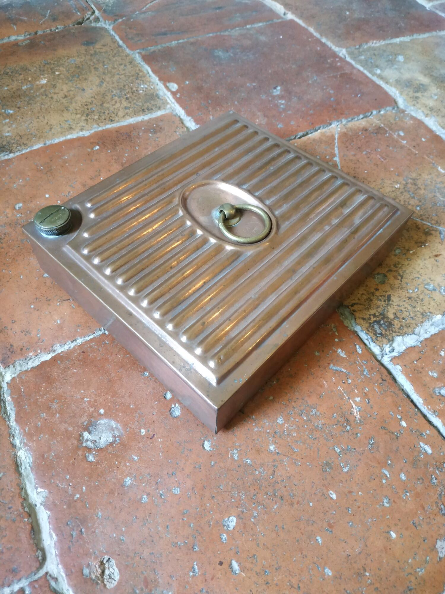 Old copper hot water bottle