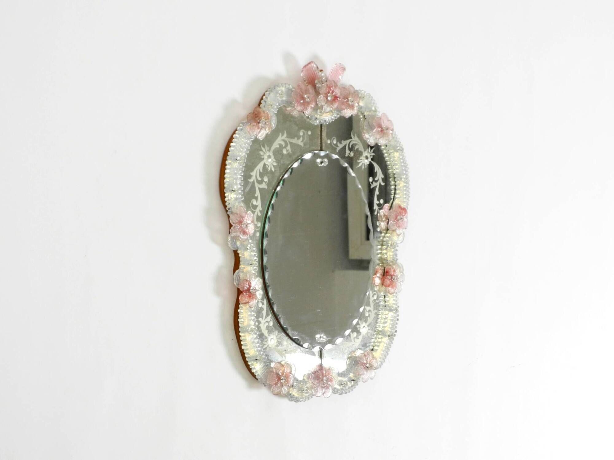 Italian mid-century wall mirror with a Murano glass frame and blossoms